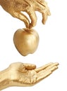 Gold hand giving apple Royalty Free Stock Photo