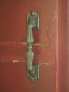 Gold handle on the red wooden door Royalty Free Stock Photo