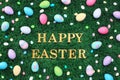 Gold Happy Easter text surrounded with Easter eggs and candy on grass