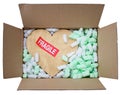 Gold heart in box with fragile sticker Royalty Free Stock Photo