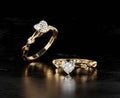 Gold heart diamond ring placed on black glossy background 3d rendering Royalty Free Stock Photo