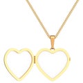 Gold heart shaped locket on chain isolated on white Royalty Free Stock Photo