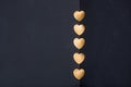 Gold heart stickers on dark background with blank space Royalty Free Stock Photo