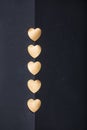 Gold heart stickers on dark texture background Royalty Free Stock Photo