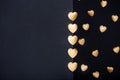 Gold heart stickers over dark textured background Royalty Free Stock Photo