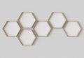 Gold hexagon blank photo frames mockup hanging on interior wall. Hexagonal pictures on painted surface. 3D rendering Royalty Free Stock Photo