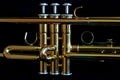 Gold trumpet and black background Royalty Free Stock Photo