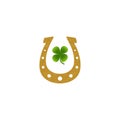 Gold horseshoe green four- leaf clover