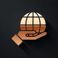 Gold Human hand holding Earth globe icon isolated on black background. Save earth concept. Long shadow style. Vector. Royalty Free Stock Photo