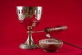 Gold incense chalice on red velvet background Royalty Free Stock Photo
