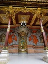 A gold-incrustated door at an inner court of a private house on Bali island in Indonesia