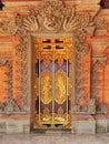 Gold incrustated door to a traditional private dwelling on Bali island in Indonesia