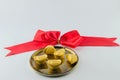 Gold ingot on golden a plates white background