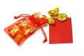 Gold ingots and coins in red sachet and red packet Royalty Free Stock Photo