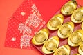 Gold ingots on red envelope of China in the Chinese New Year Royalty Free Stock Photo