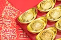 Gold ingots on red envelope of China in the Chinese New Year Royalty Free Stock Photo