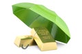 Gold ingots with umbrella, financial insurance and business stab Royalty Free Stock Photo