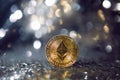 gold iron coin ethereum on shiny silver background