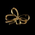 Gold jewelry in the form of a bow with white crystals. Royalty Free Stock Photo