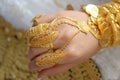 Gold jewelry on the hands of a Muslim bride.