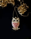 Gold jewelry owl With red stones Royalty Free Stock Photo