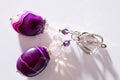 Gold jewerly earrings with agat and fluorite semiprecious at white background