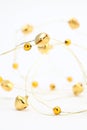Gold jingle bell chain Royalty Free Stock Photo
