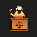 Gold Judge with gavel on table icon isolated on black background. Long shadow style. Vector