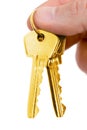 Gold key in fingers