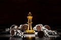 Gold king chess surrounded by a number of fallen silver chess pi Royalty Free Stock Photo