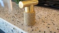 Gold kitchen countertop pull, speckled surface, modern kitchen background, interior design Royalty Free Stock Photo