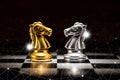 Gold knight chess facing silver knight chess on chess board and abstraction connection line network screen, business strategy Royalty Free Stock Photo