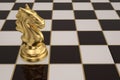 The gold knight chess piece on checkerboard.3D illustration.