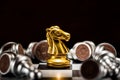 Gold knight chess surrounded by a number of fallen silver chess Royalty Free Stock Photo