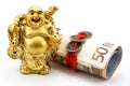 Gold laughing Buddha with money and chinese coins Royalty Free Stock Photo