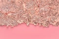 Gold leaf border, torn foil edges on pink, abstract background.