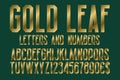 Gold leaf font of letters, numbers with currency signs of dollar and euro. Isolated typographic symbols Royalty Free Stock Photo