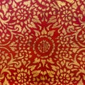 The gold leaf on wood for the background and textures. Thai style pattern on red wall Royalty Free Stock Photo