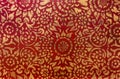 The gold leaf on wood for the background and textures. Thai style pattern on red wall Royalty Free Stock Photo