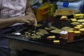 Gold leaves to decorate jewelry. Mandalay, Myanmar