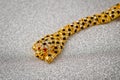 Gold leopard bracelet with shiny pebbles, lepard eyes made of bright red stones Royalty Free Stock Photo