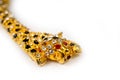 Gold leopard bracelet with shiny pebbles, lepard eyes made of bright red stones Royalty Free Stock Photo