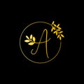A Gold letter and Gold Leaf logo design. A Letter golden initial luxury Boutique Nature Floral Flower. A Monogram vector design