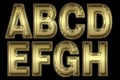 Alphabet in gold leaf isolated on black Royalty Free Stock Photo