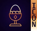 Gold line Chicken egg on a stand icon isolated on black background. Vector