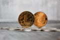 Gold Litecoin coin and titan bitcoin Royalty Free Stock Photo