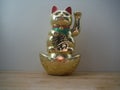 Gold Maneki Neko Japan Lucky Cat, Isolated with Clipping path Royalty Free Stock Photo