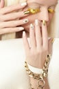 Gold manicure . Royalty Free Stock Photo