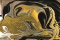 Gold marbling texture design. Beige and golden marble pattern. Fluid art. Royalty Free Stock Photo