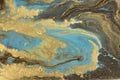 Gold marbling texture design. Blue and golden marble pattern. Fluid art.